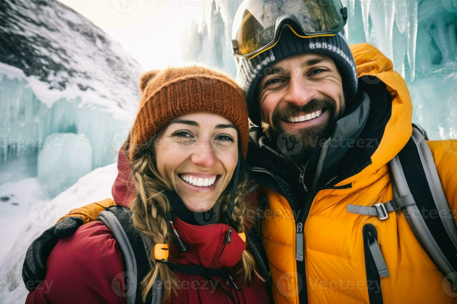 Thrilled couple ice climbing sparkling frozen waterfall background with empty space for text photo