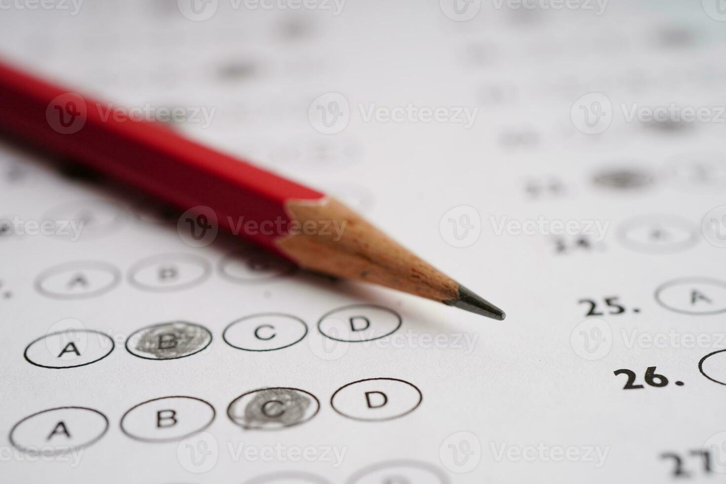 Answer sheets with pencil drawing fill to select choice, education concept. photo