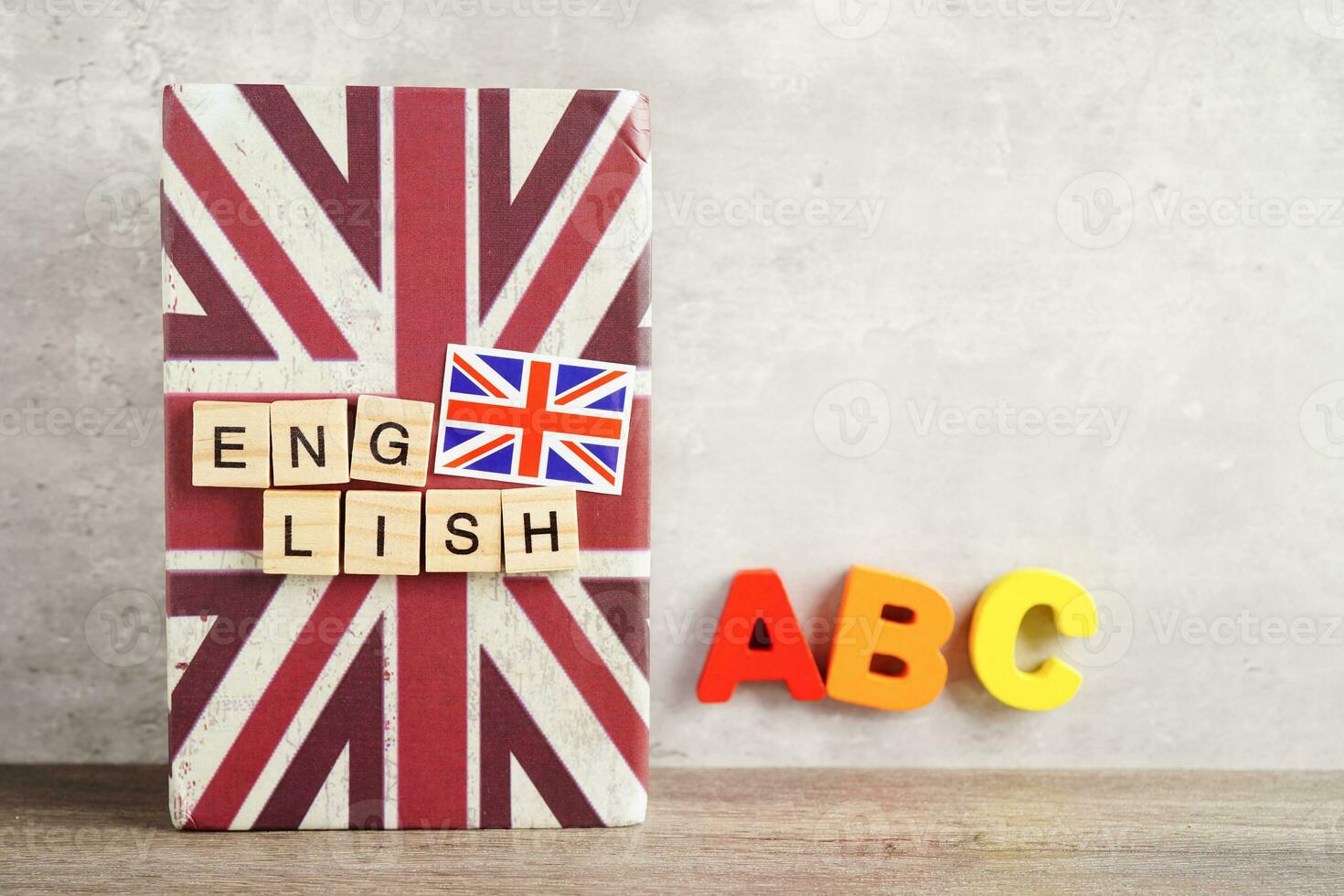 English book with graduate hat, learning and tutorial for foreigner. photo