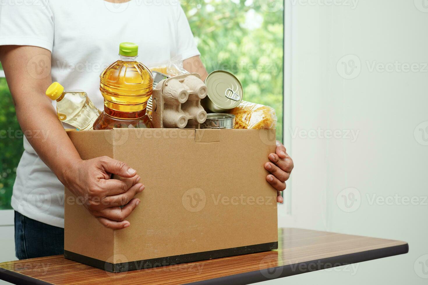 Foodstuffs in donation box for volunteer to help people. photo