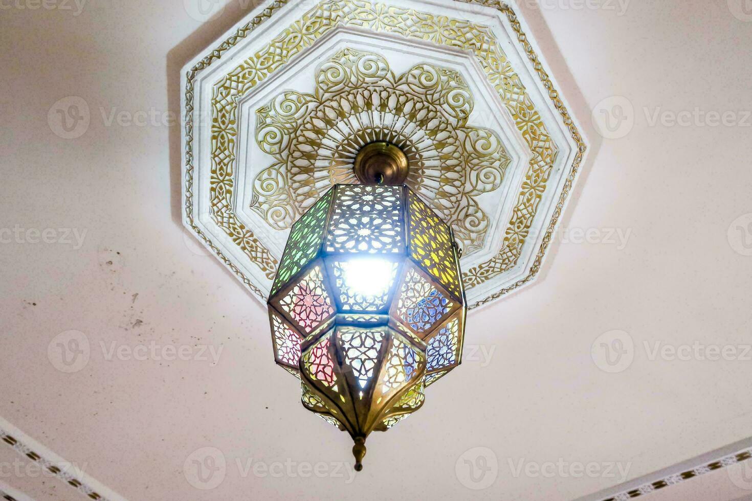 a decorative ceiling light with intricate designs photo