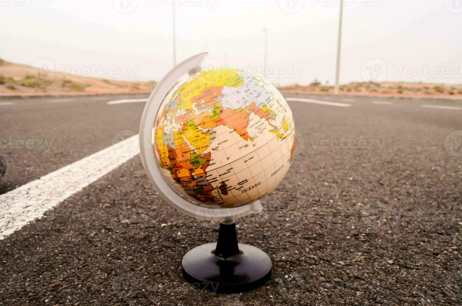a globe on the road photo