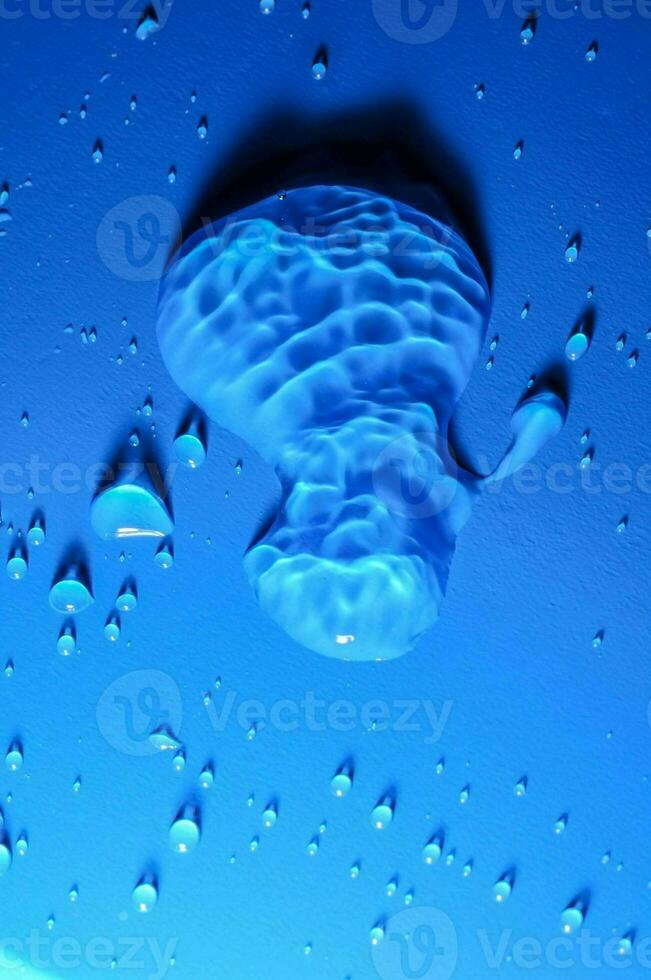 drops of water on a blue surface photo
