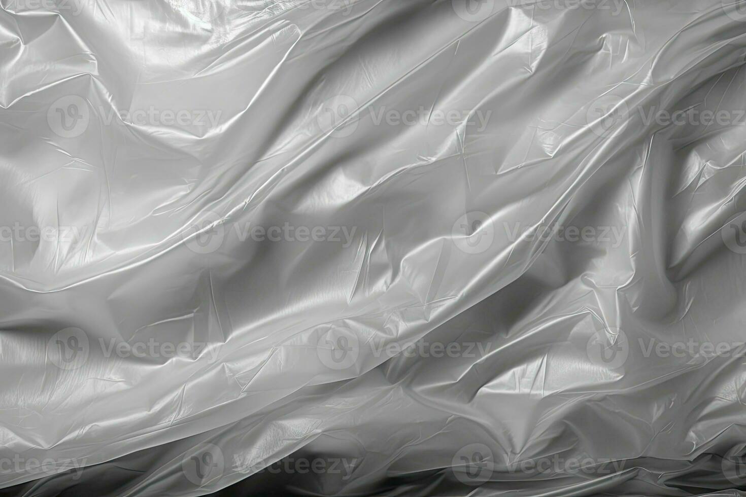 gradient gray plastic wrap overlay backdrop. crumpled and draped textured cellophane material photo