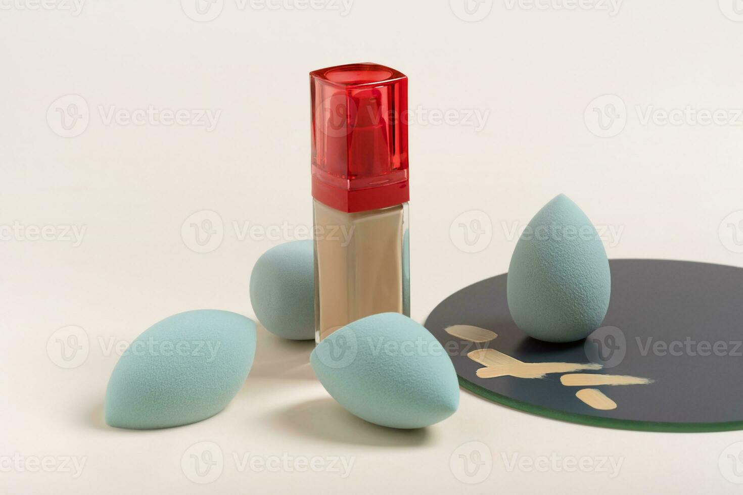 blue cosmetic makeup sponge on a beige nude background. A set of sponges of different shapes. Tool photo