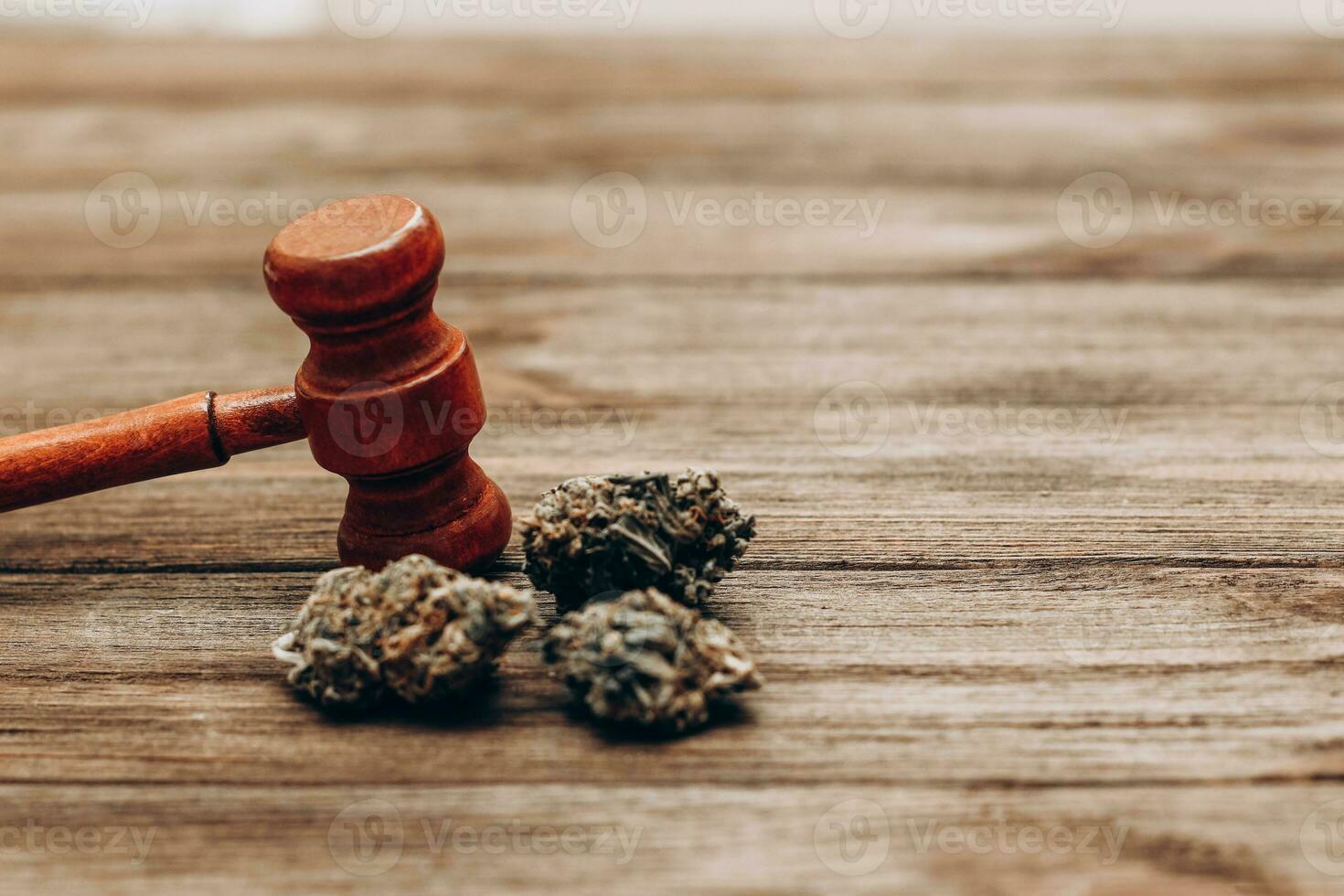 Medical marijuana, inflorescences of shinki herb plant with judge's gavel, law concept photo