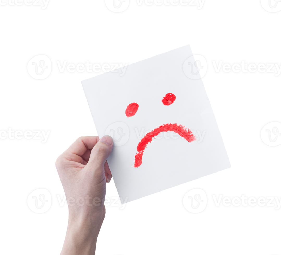 Hand holding white paper with hand drawn unhappy face emoticons isolated on transparent background. PNG Format
