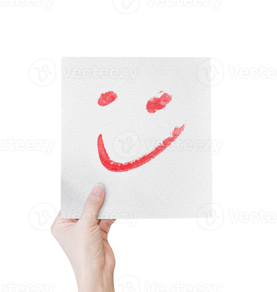 Hand holding white paper with hand drawn smiley face emoticons isolated on transparent background. PNG Format