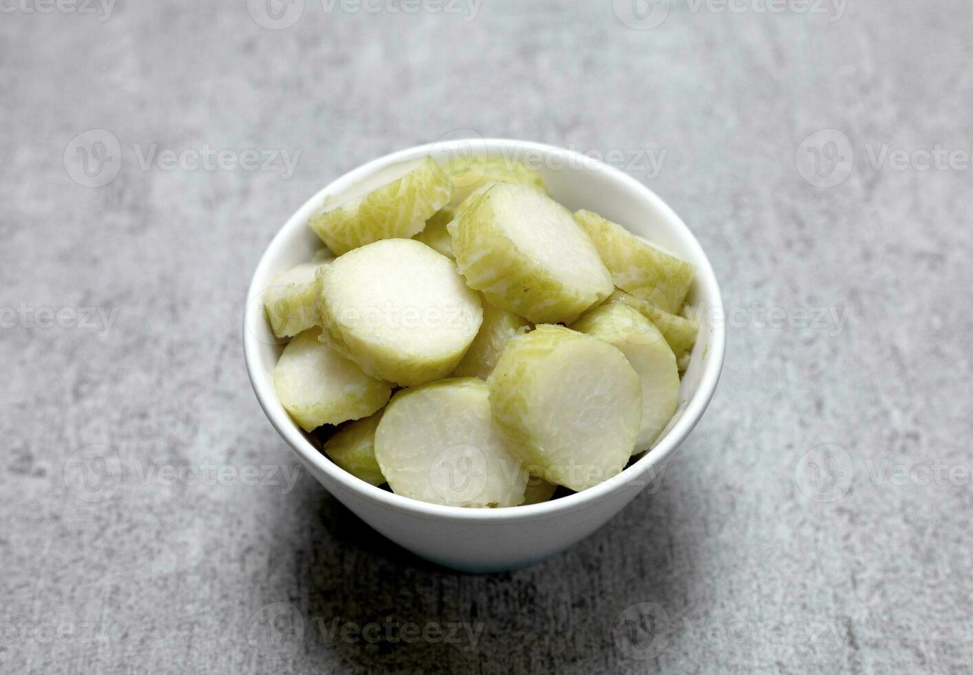 lontong or rice cake, a traditional from indonesia, food wrapped in banana leaf photo