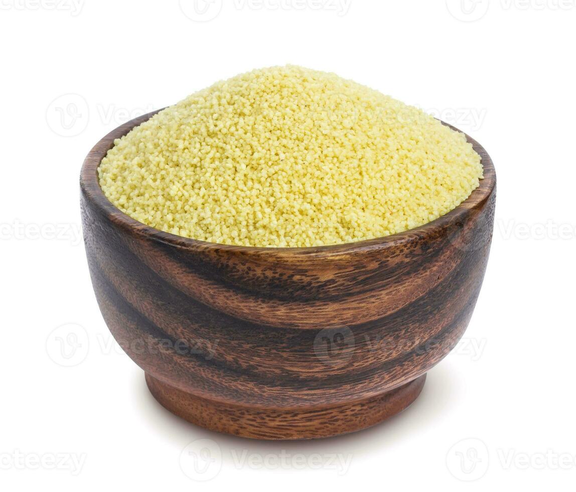 Couscous in wooden bowl isolated on white background photo