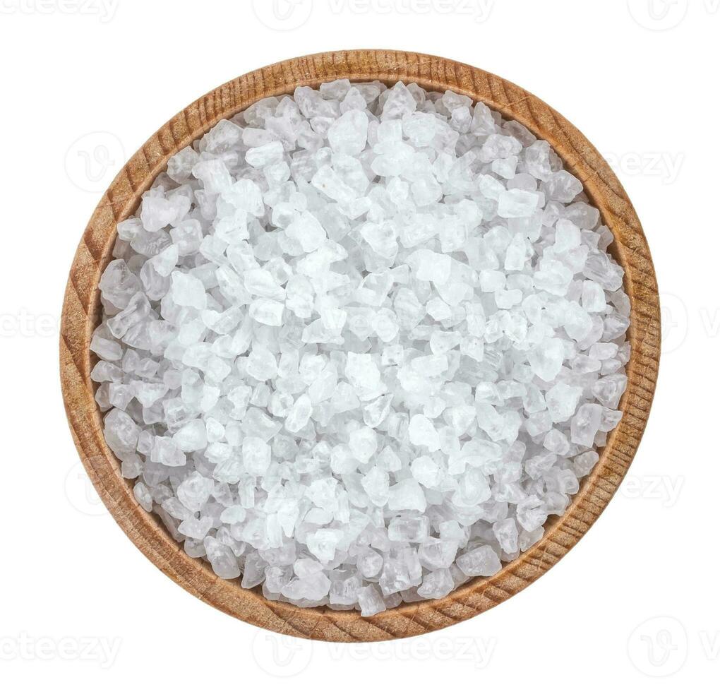 Sea salt in wooden bowl top view photo