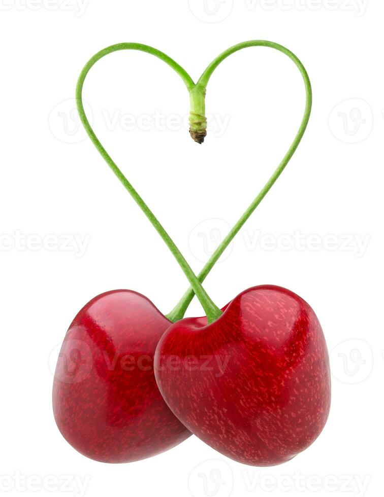 Heart shape from two cherries over white photo