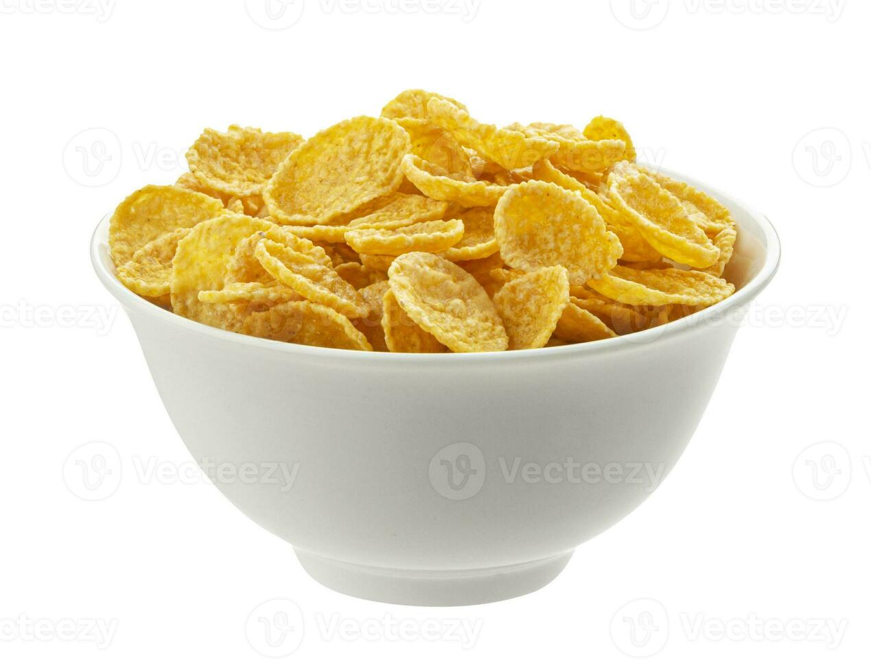 Bowl of corn flakes isolated on white background, top view photo
