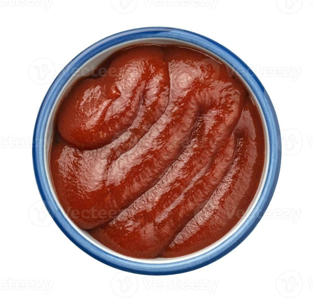 Ketchup isolated on white background, top view photo