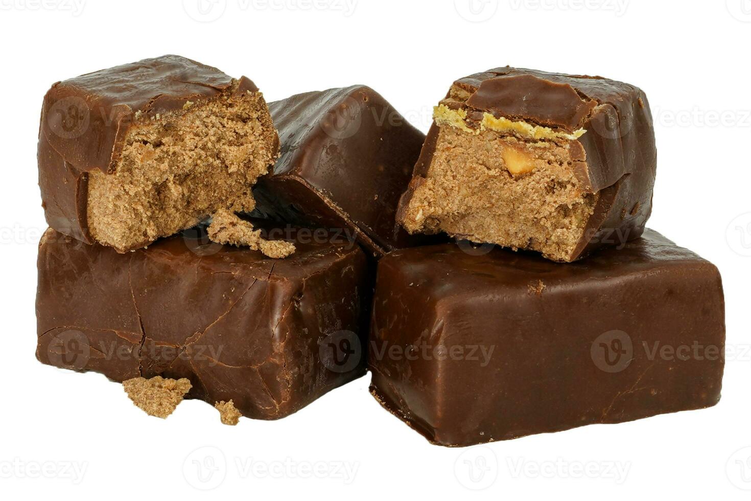 Chocolate candies with peanuts. Small chocolates without background. photo