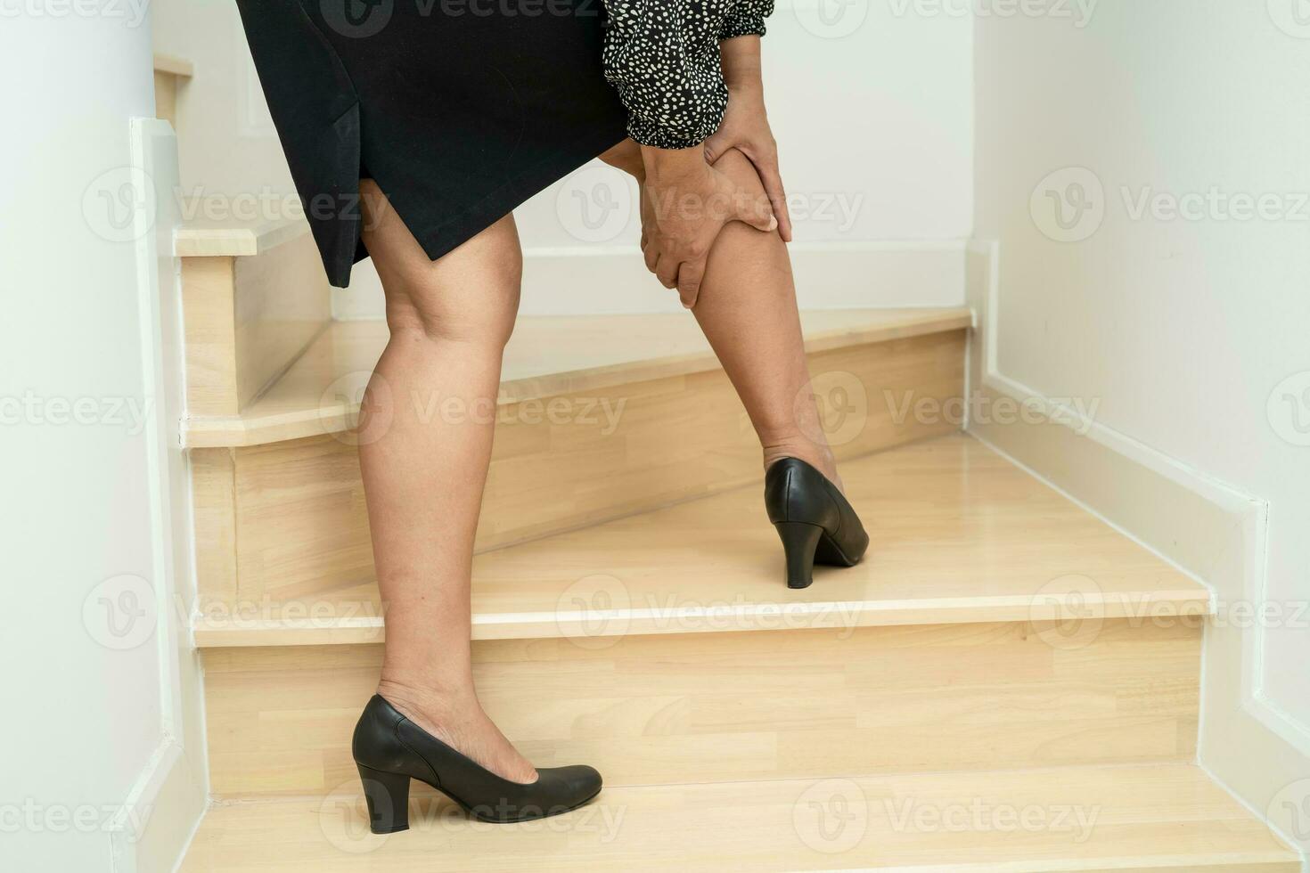 Asian woman patient fall down the stairs because slippery surfaces. photo