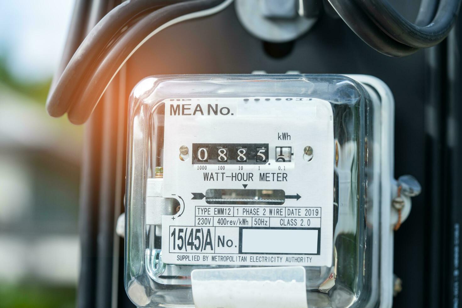 Electric measuring power meter for energy cost at home and office, solar cell concept. photo