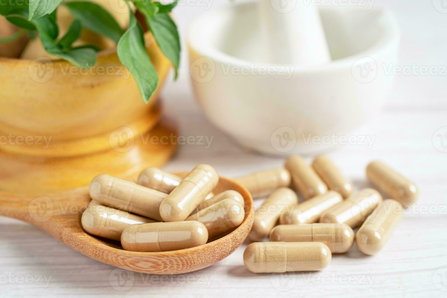 Alternative medicine herbal organic capsule with vitamin E omega 3 fish oil, mineral, drug with herbs leaf natural supplements for healthy good life. photo