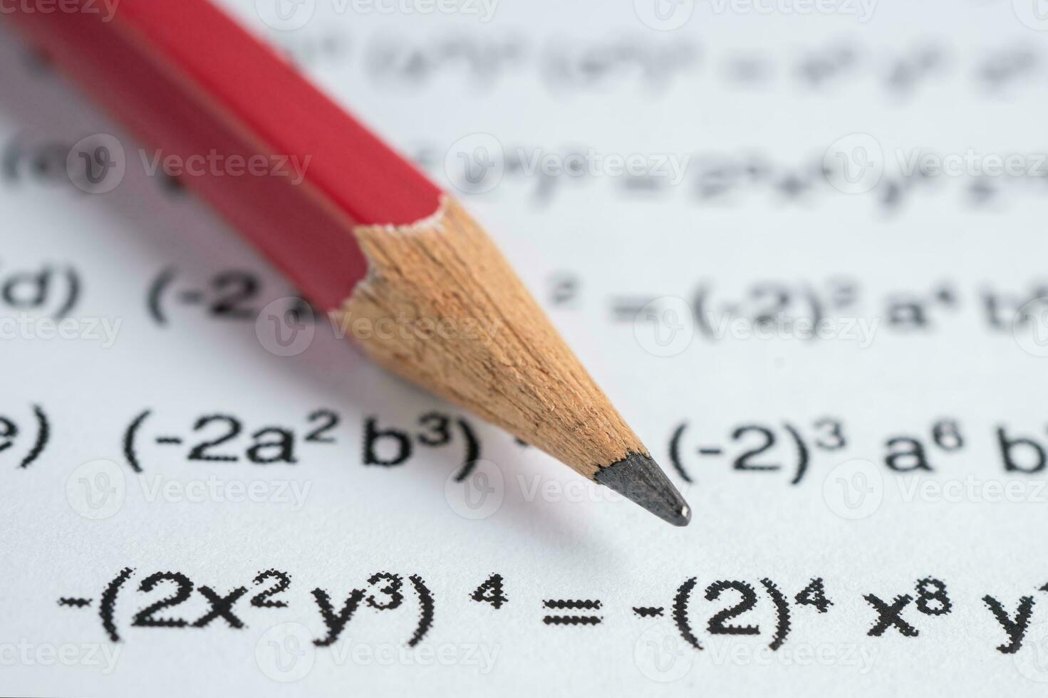 Pencil on mathematic formula exercise test paper in education school. photo