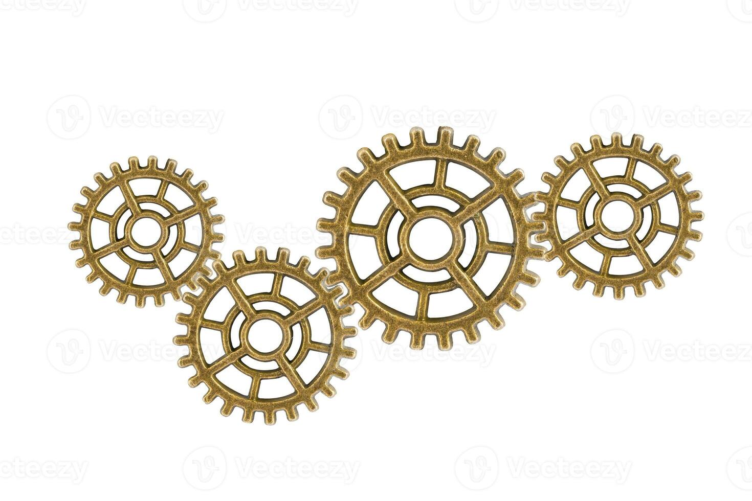 Gear and cogs wheels isolated on a white background, clock mechanism, brass metal engine industrial. photo