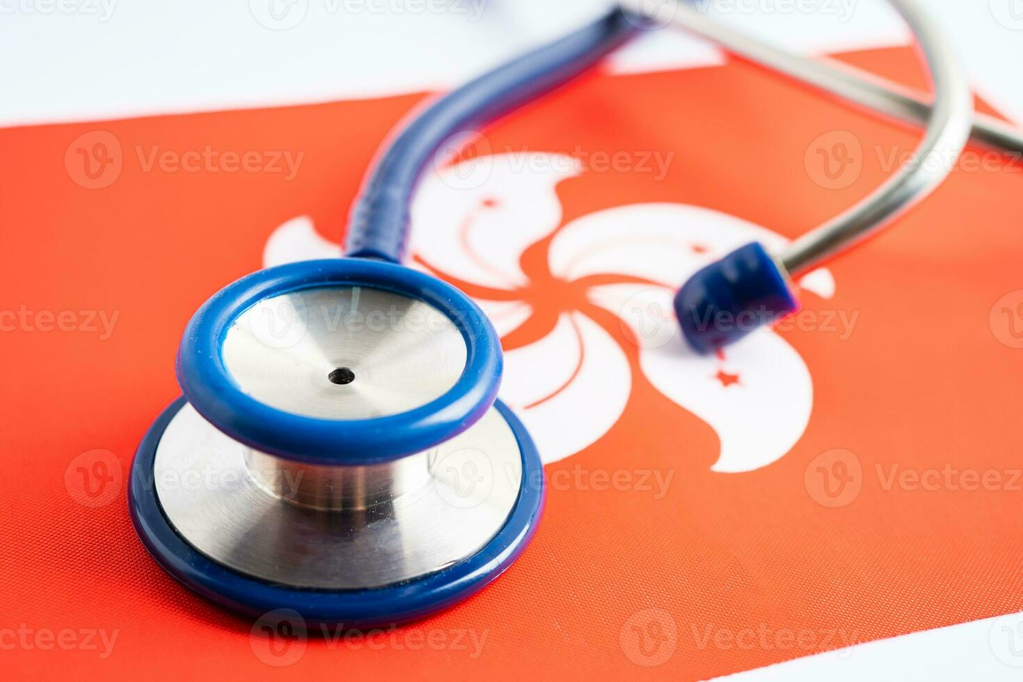 Stethoscope on Hong Kong flag background, Business and finance concept. photo