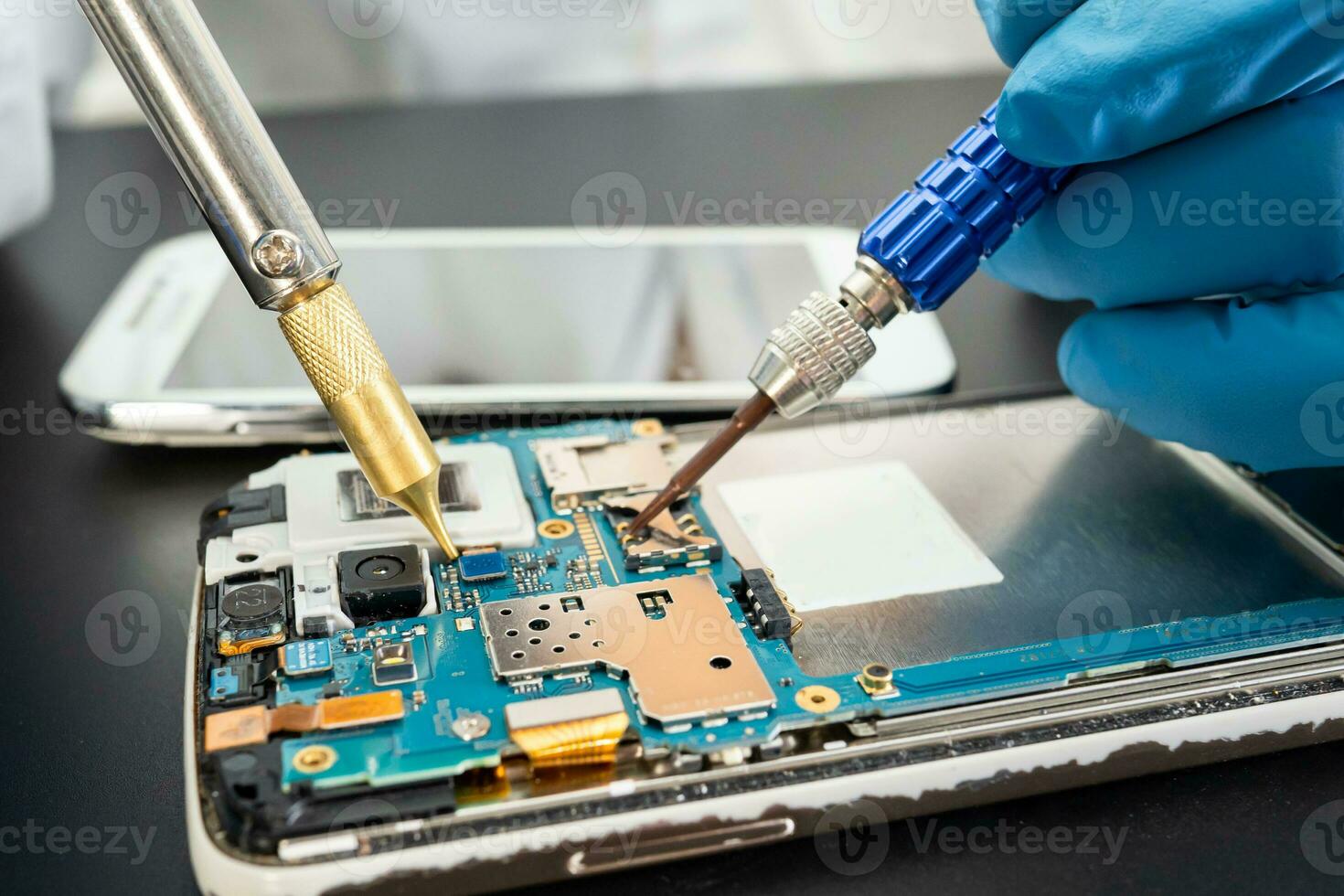Repairing and upgrade Samsung mobile phone, electronic, computer hardware and technology concept. photo
