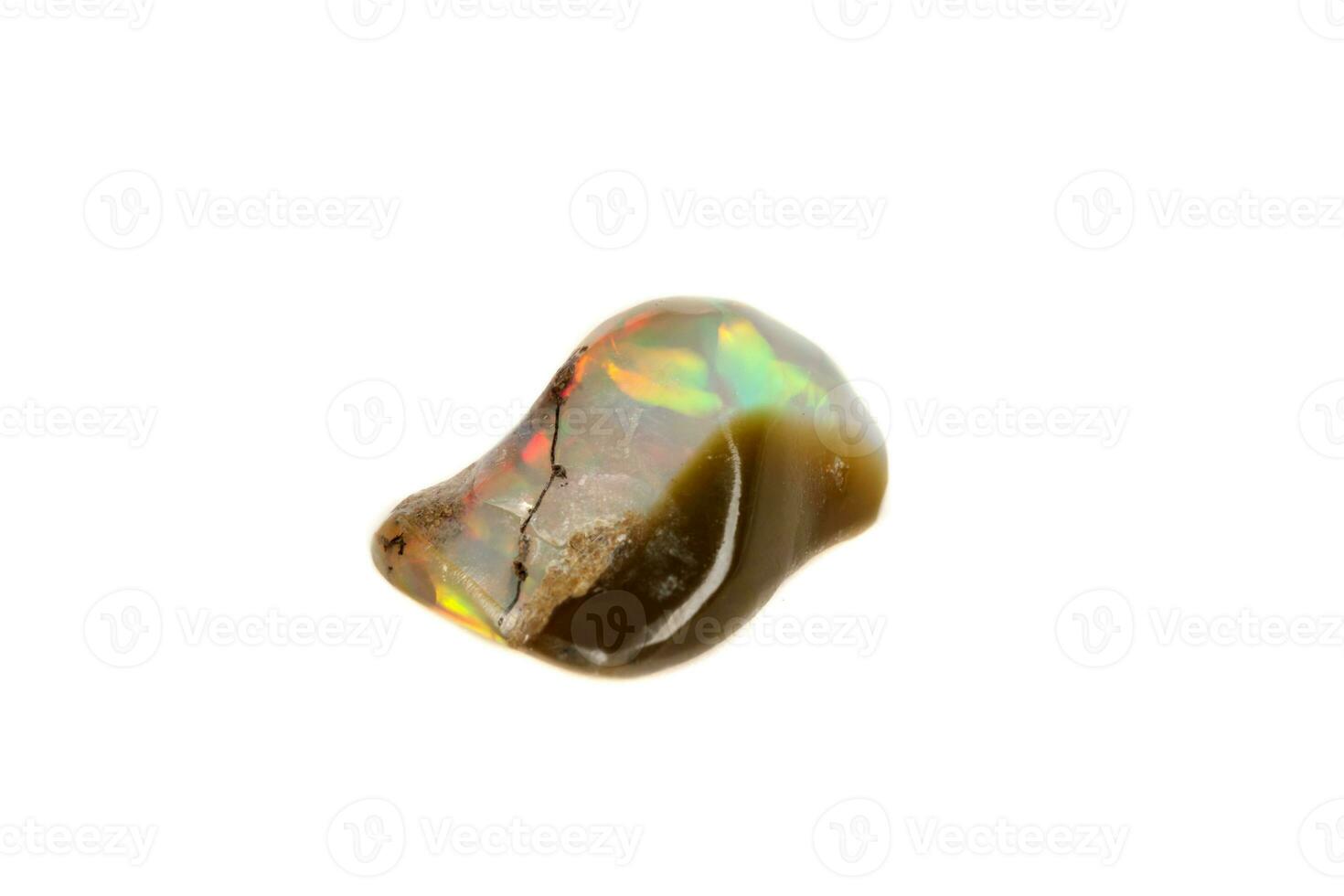 Macro Opal mineral stone in rock on white background photo