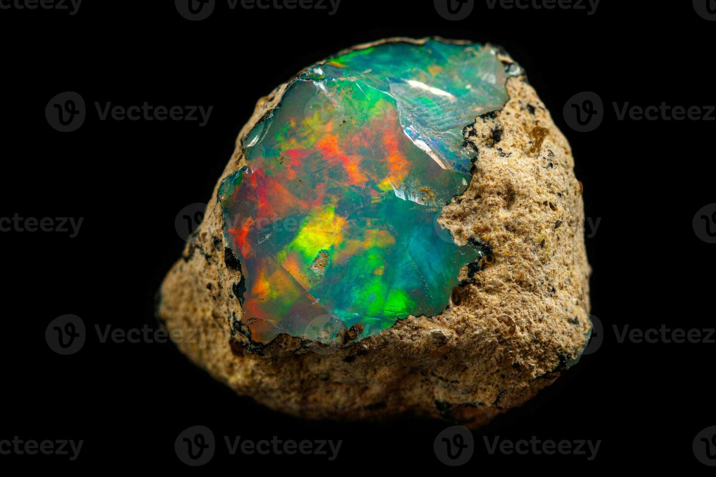 macro mineral stone rare and beautiful opals on a black background photo