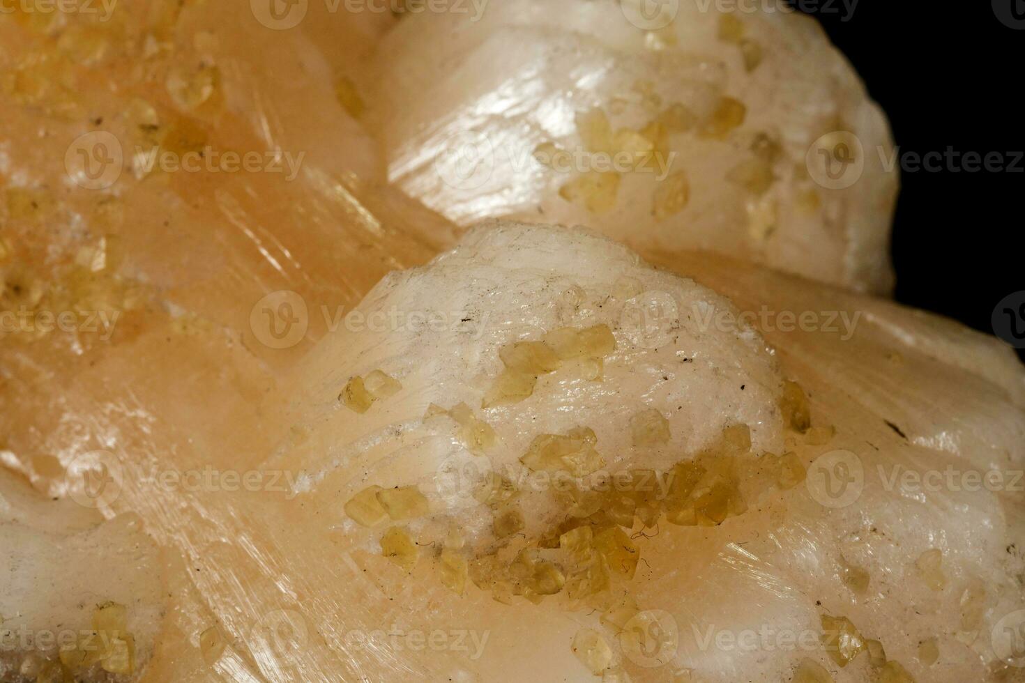 Macro mineral stone Stilbite on Apophyllite on a black background photo