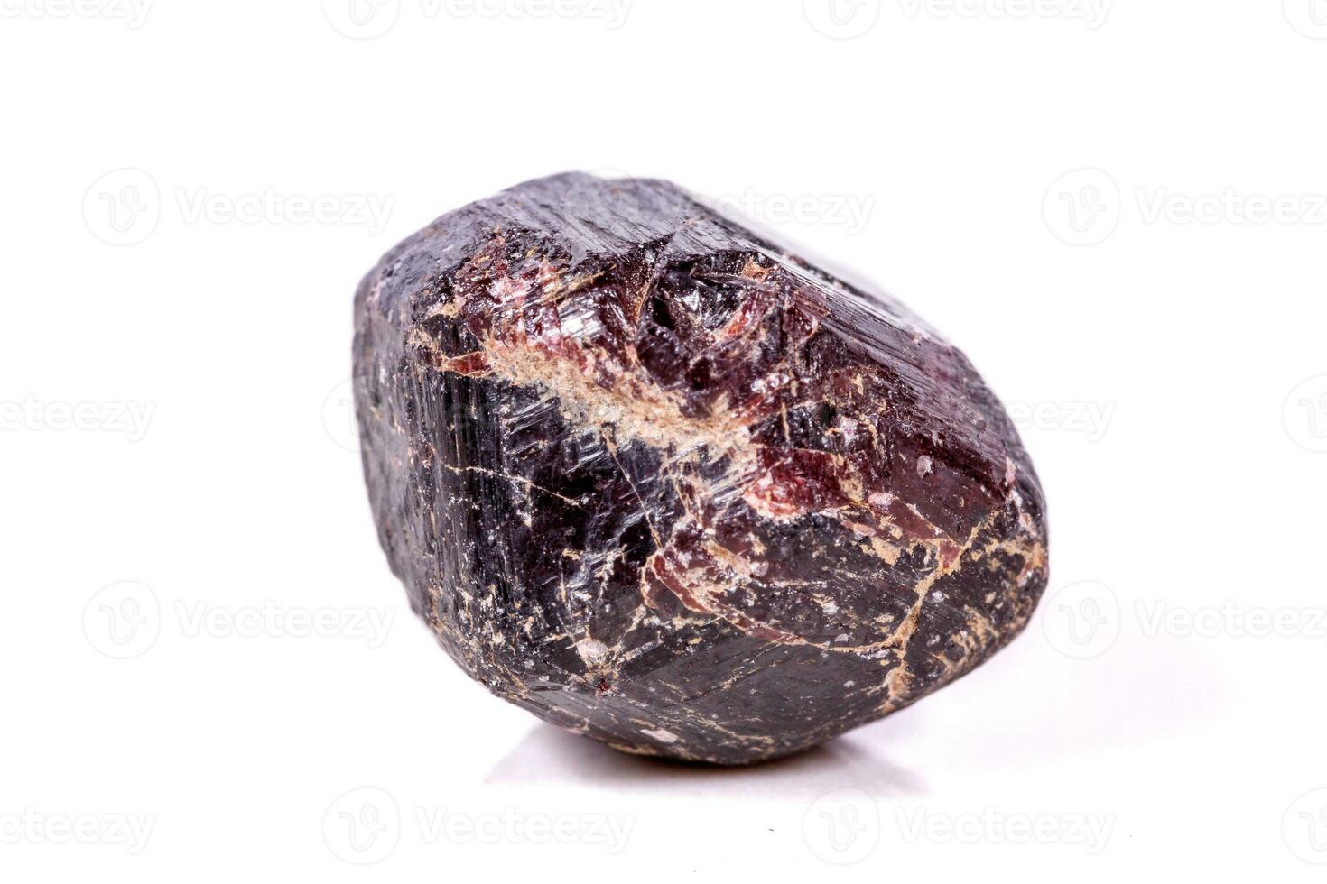 Macro of a mineral garnet stone on a white background photo