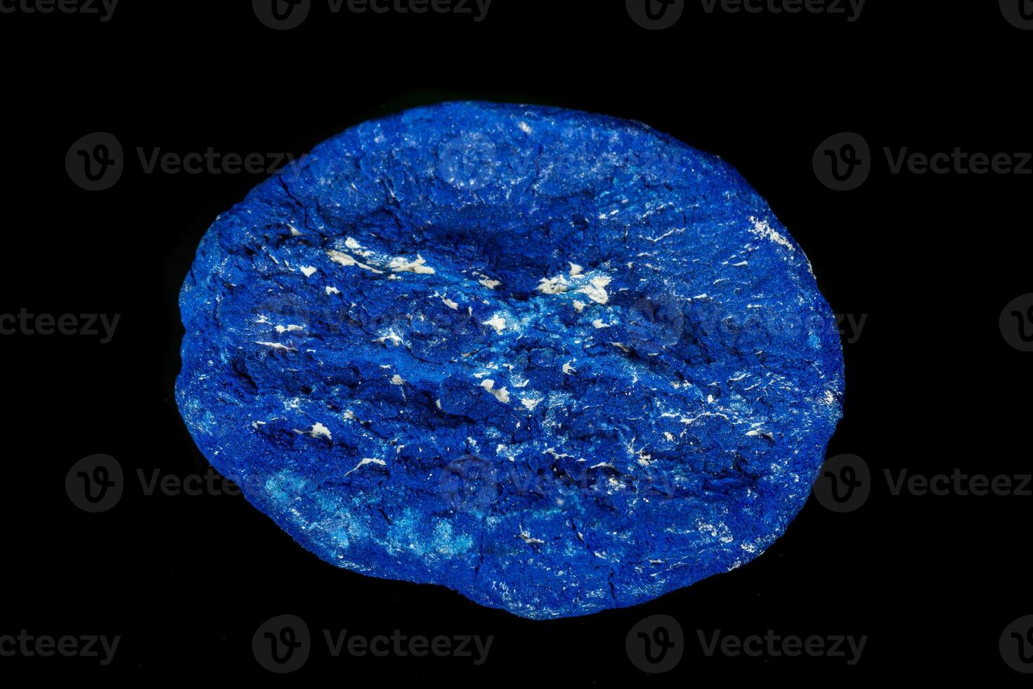 Macro mineral stone Azurite in siltstone against black background photo