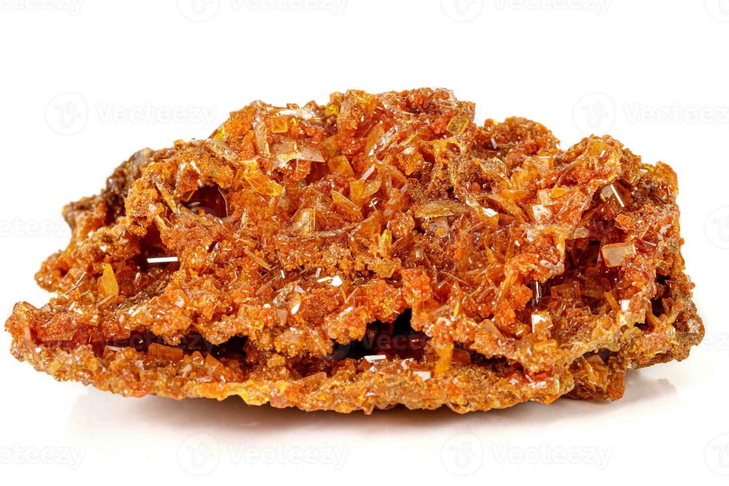Macro stone mineral Wulfenite on a white background photo