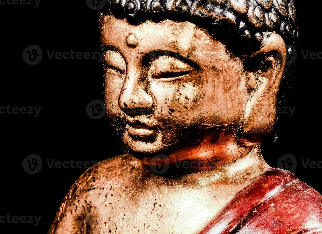 a close up of a buddha statue photo