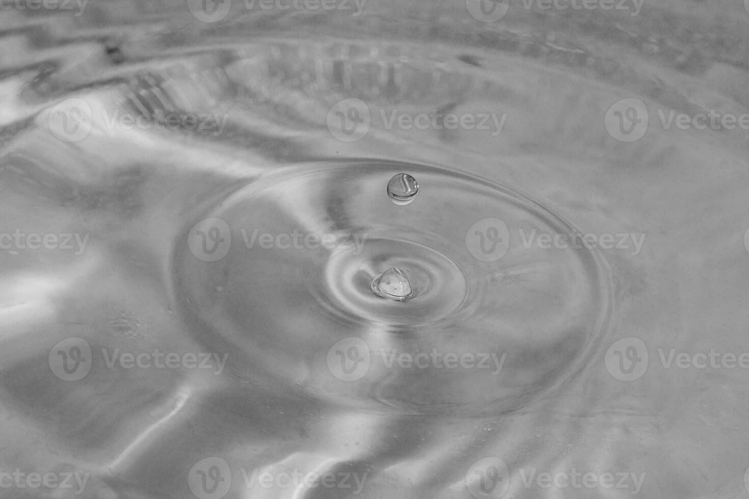 falling drops in water photo