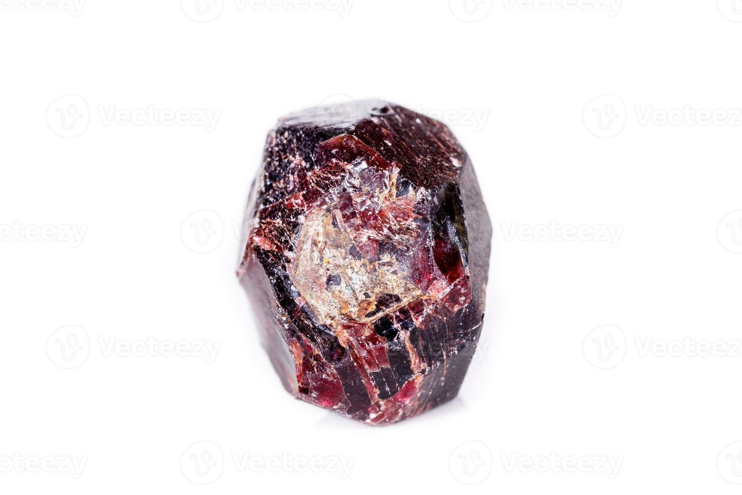 Macro of a mineral garnet stone on a white background photo