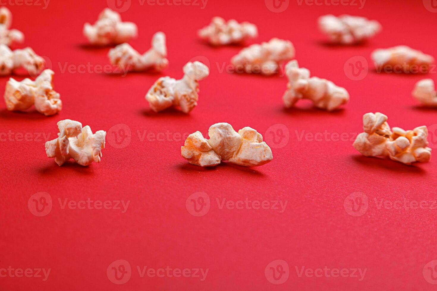 popcorn macro on a red background photo