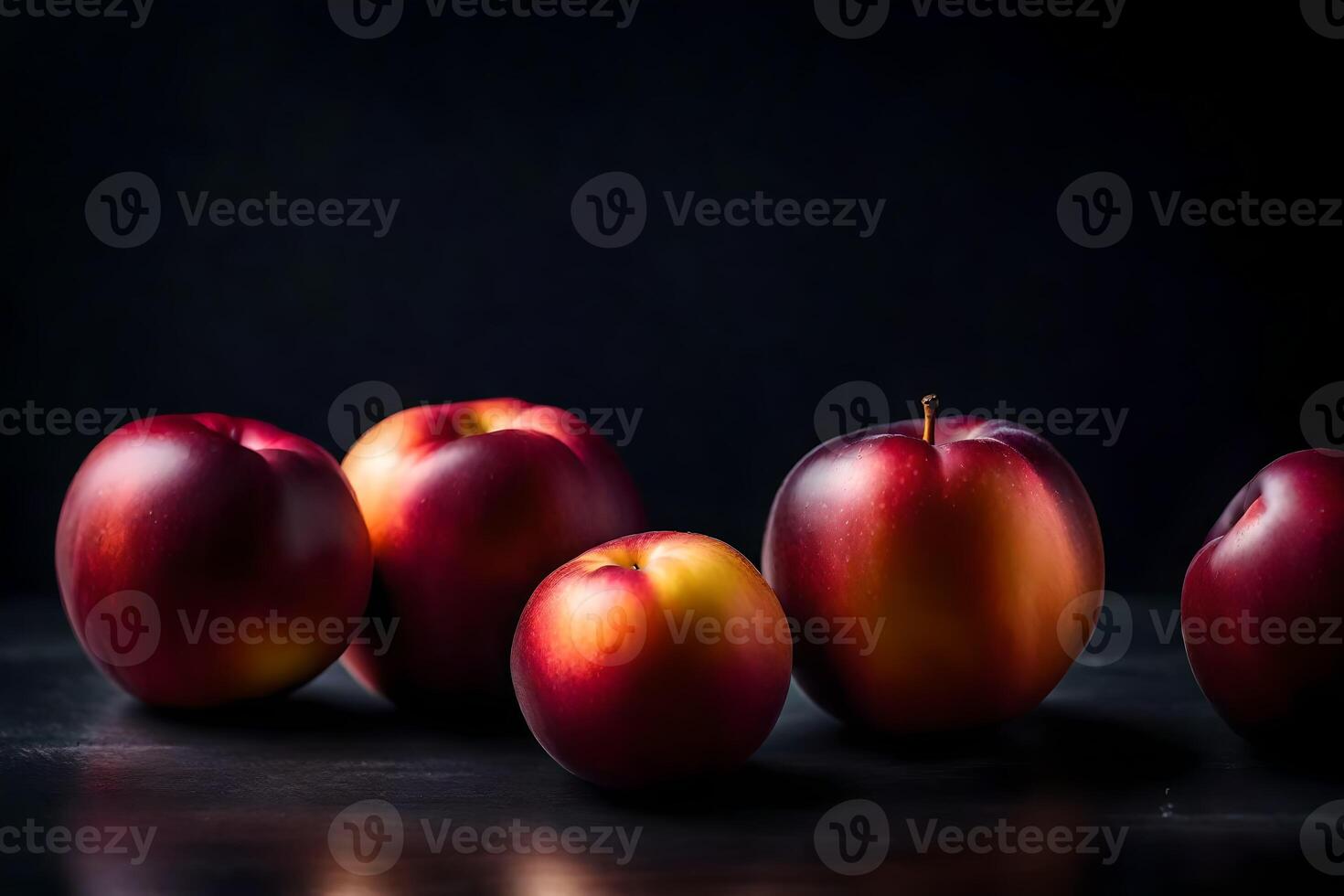 Take a close look at nectarines in a photography studio with a black background photo