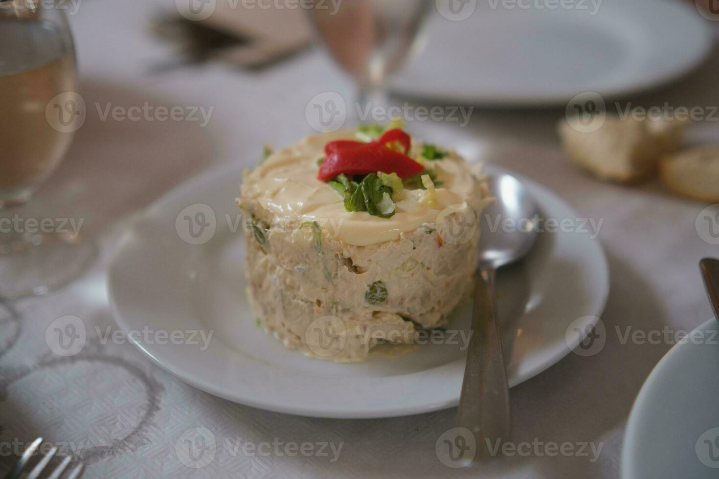 Traditional spanish russian salad with mayonnaise. Tapas food. photo