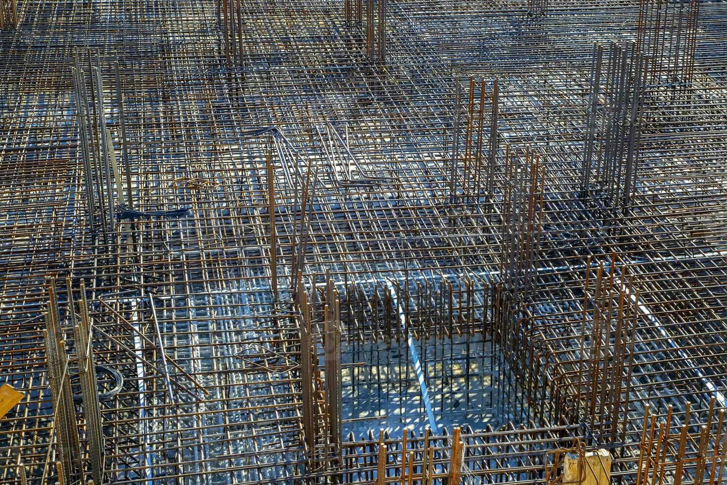 Billets of reinforcement at the construction site. New construction. Reinforced concrete construction. photo