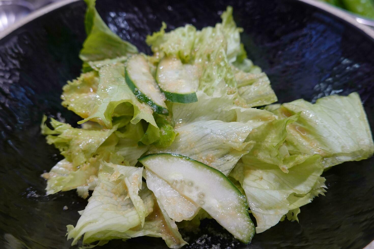 Close-up of fresh raw assorted vegetables like lettuce, crown daisy and green peppers on a  basket, South Korea photo