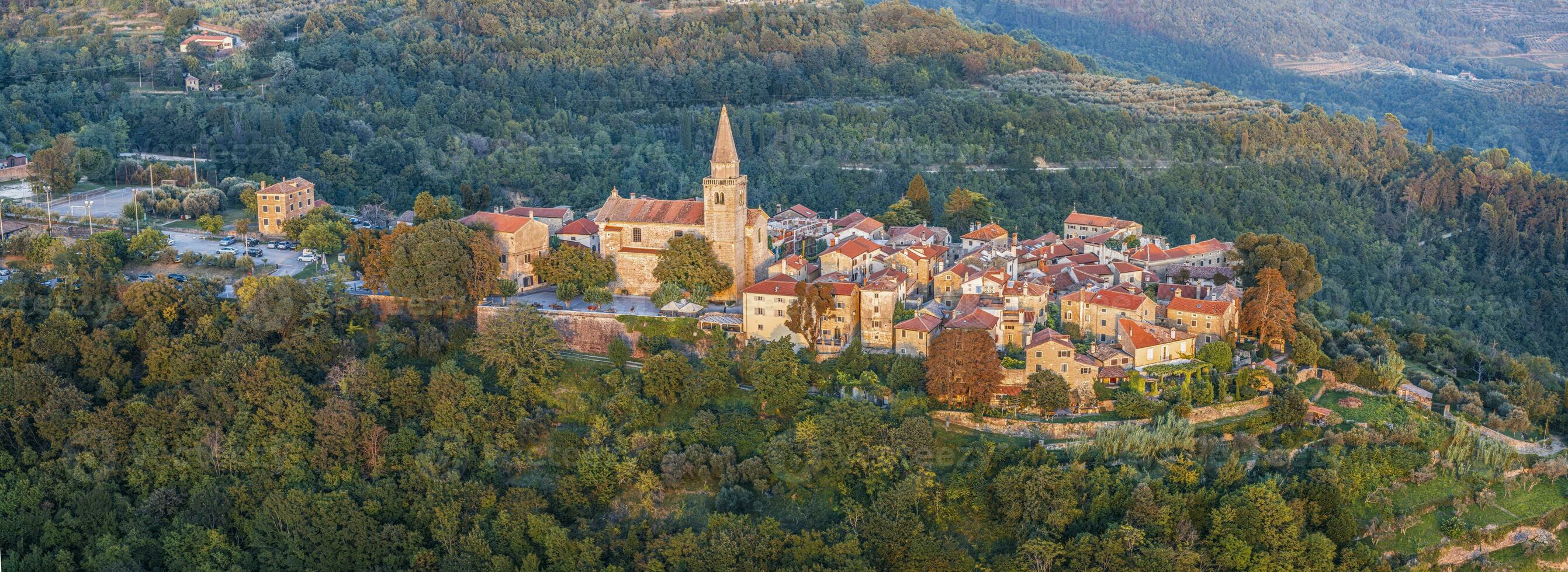 Drone panorama over the historic artists' town of Groznjan in central Istria at sunset photo