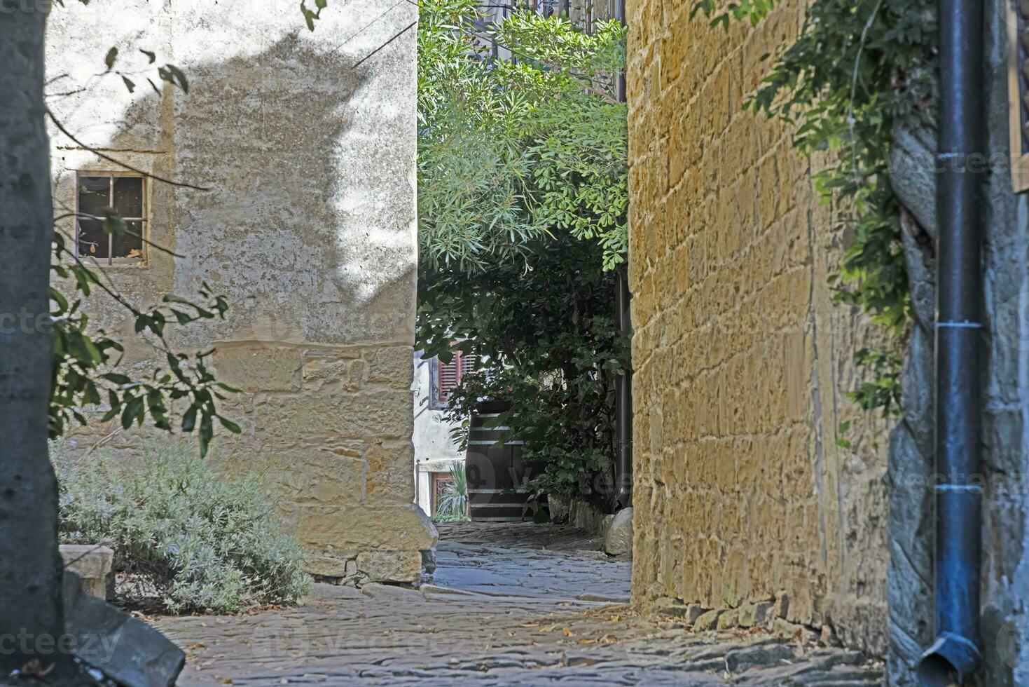 Picture from the town of Groznjan with idyllic cobbled streets and buildings made of natural stone photo