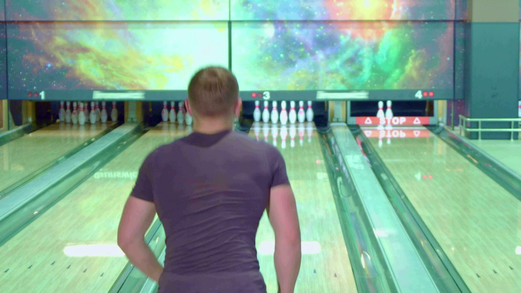 Guy moonwalks at the bowling alley photo