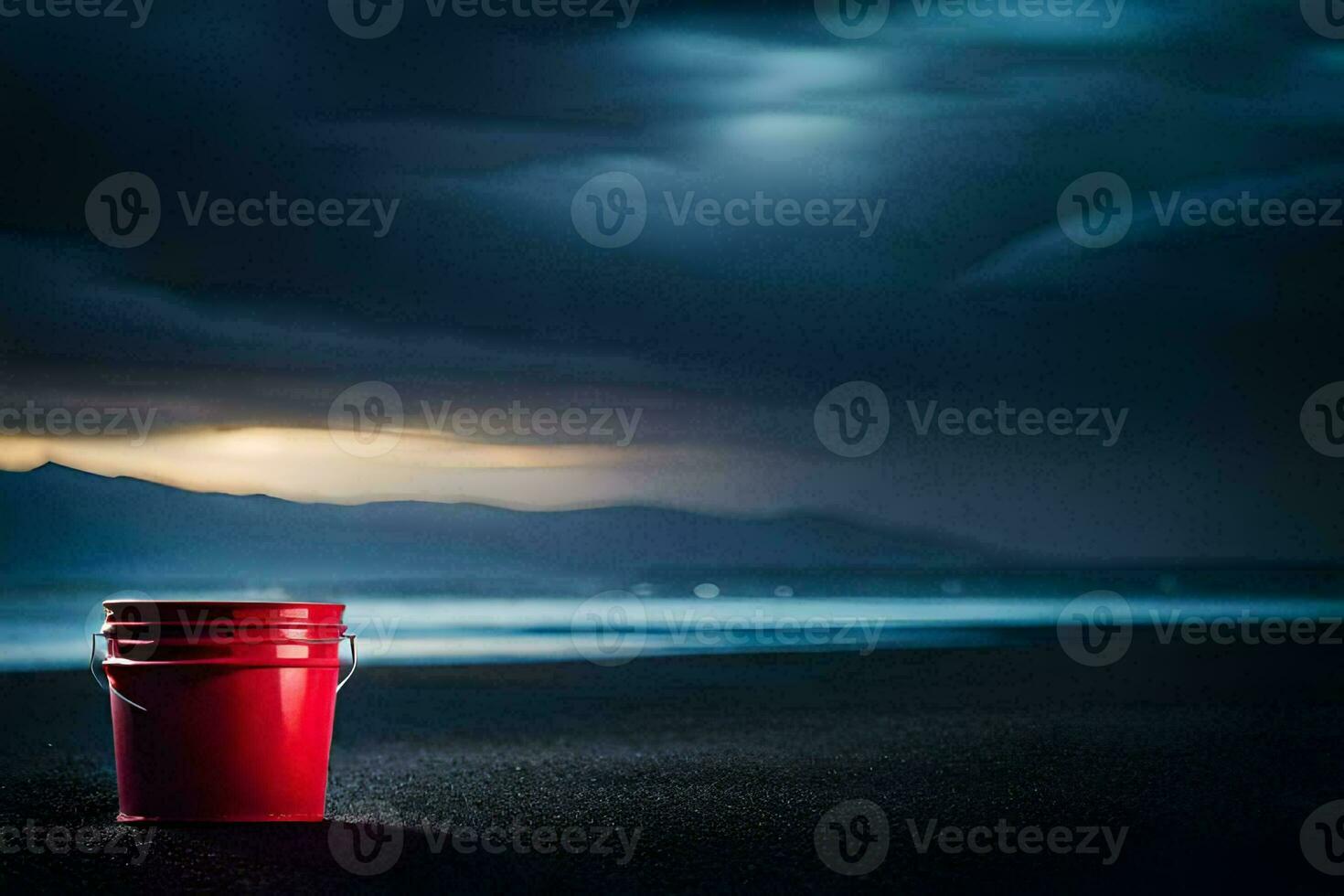 a red bucket sits on the beach at night. AI-Generated photo