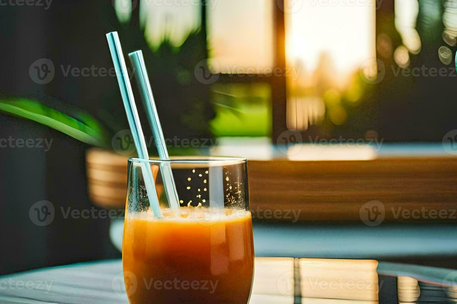 un vaso de naranja jugo con pajitas en un mesa. generado por ai foto