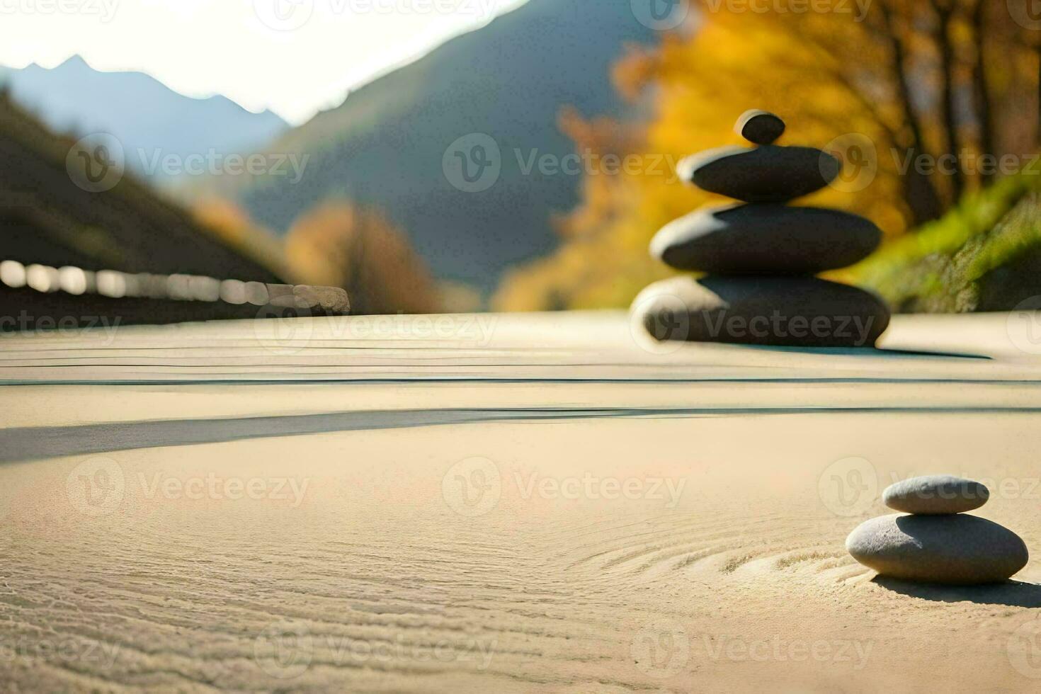 a stack of stones on the sand in front of a mountain. AI-Generated photo