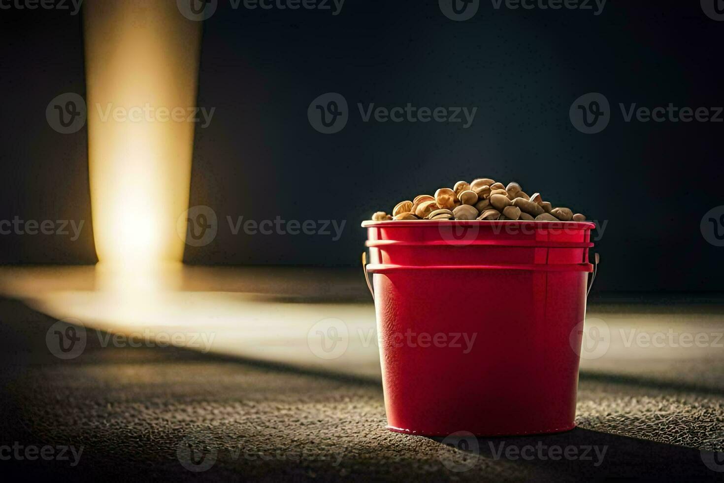 a red bucket filled with peanuts sitting on a concrete floor. AI-Generated photo