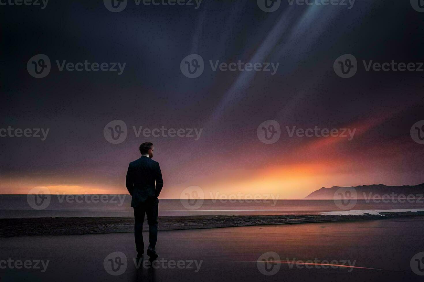 a man standing on the beach looking at the sunset. AI-Generated photo