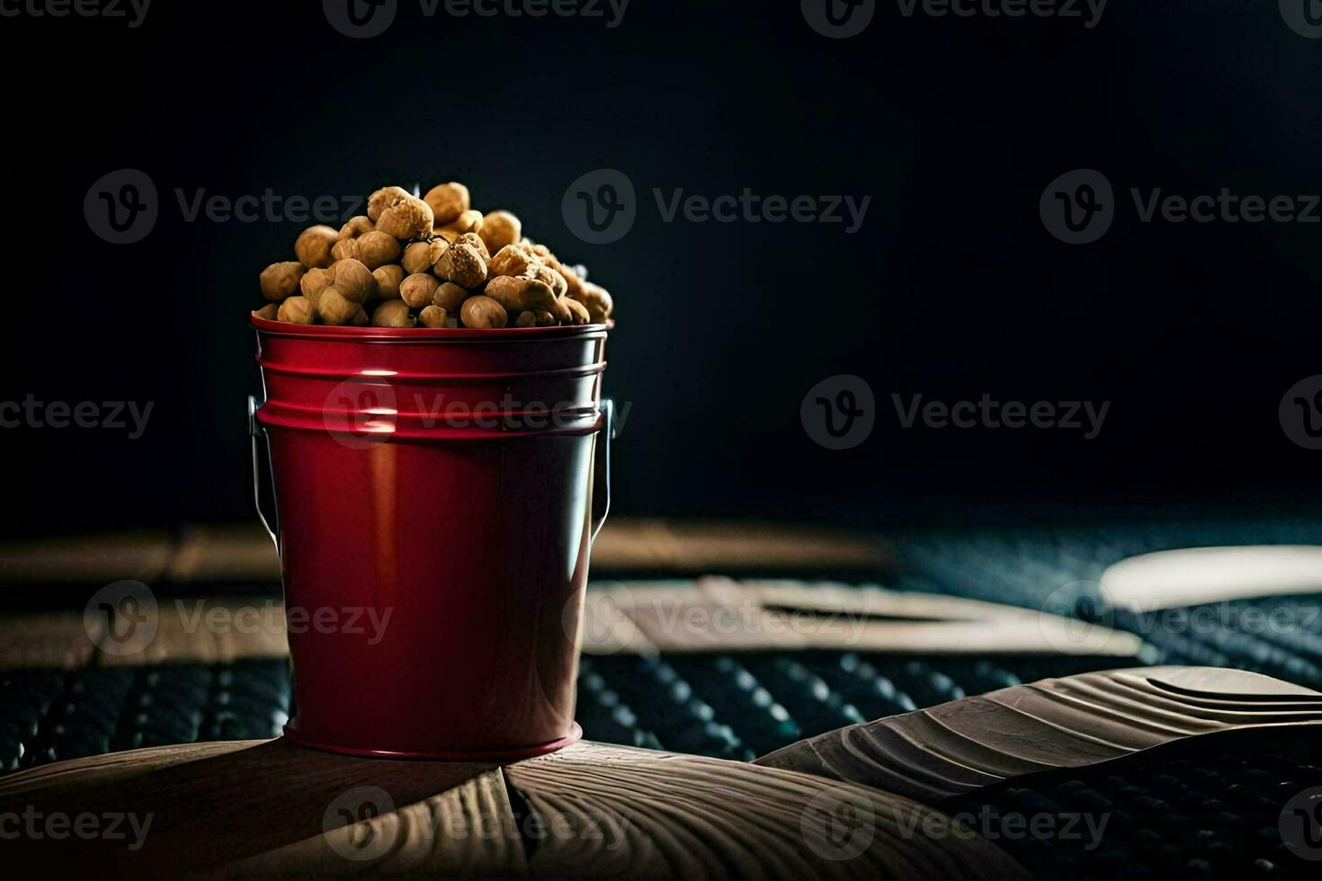 a red bucket filled with peanuts sitting on a wooden table. AI-Generated photo
