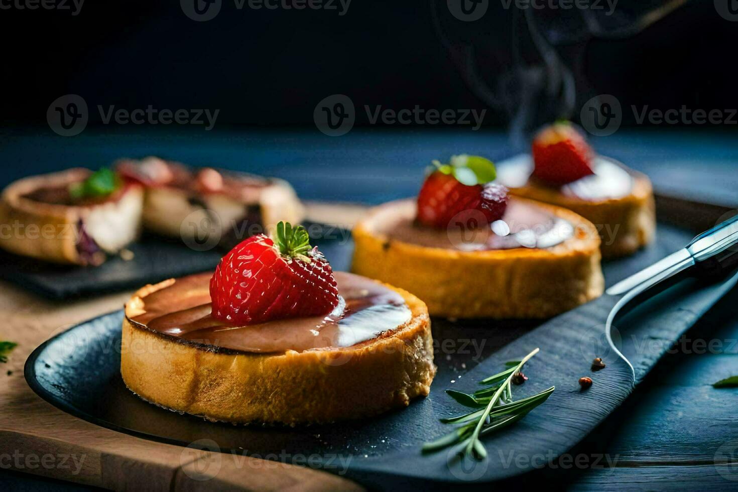 small cheesecakes with strawberries on a black plate. AI-Generated photo